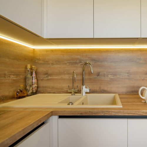 Modern white and beige wooden kitchen interior details